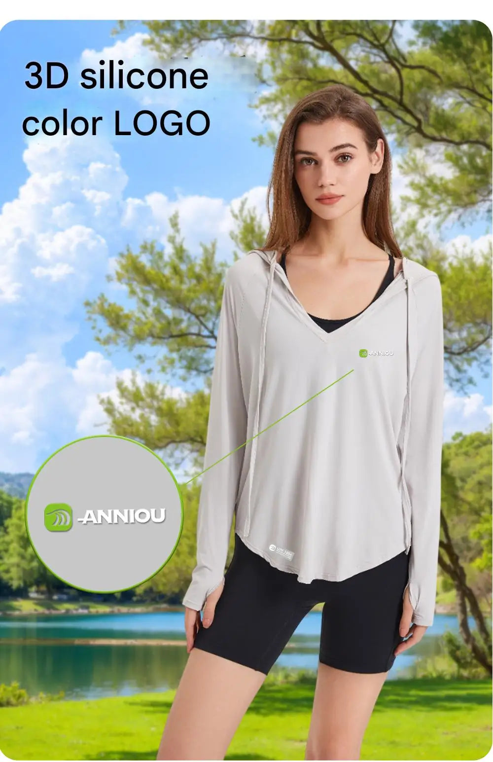 Woman wearing a light gray long-sleeve top and black shorts with a scenic background, featuring the LANNIOU brand logo.