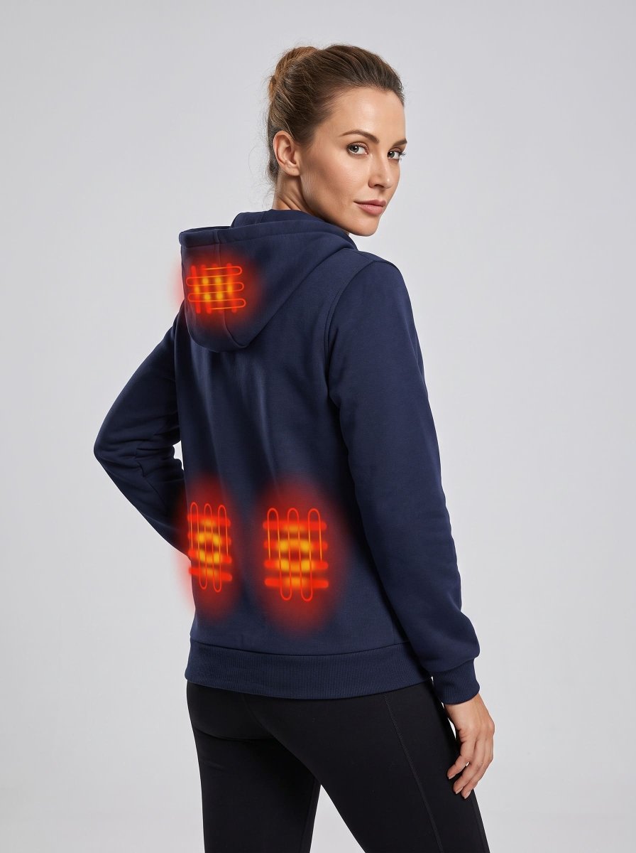 A woman wearing a navy blue heated hooded sweatshirt, shown from the back and side. The image features digital overlays highlighting the glowing heat elements on the back of the hoodie.