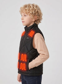 Side view of boy wearing black heated vest, one hand in side pocket, show vest silhouette and armhole design, glowing red heating zones, , kids winter thermal waistcoat