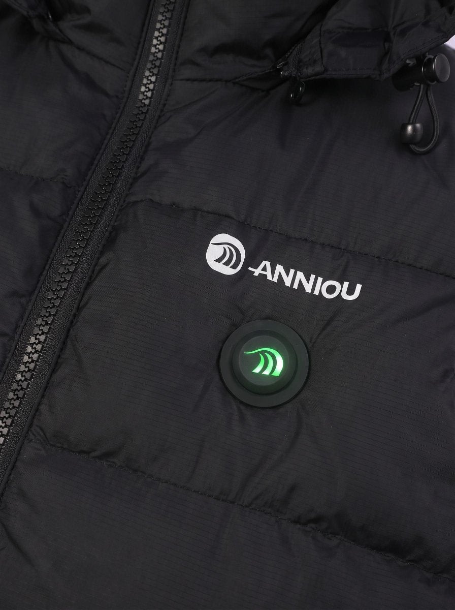 Close-up of a black puffer jacket with a white ANNIOU logo and a circular black control button with a glowing green light on the chest.