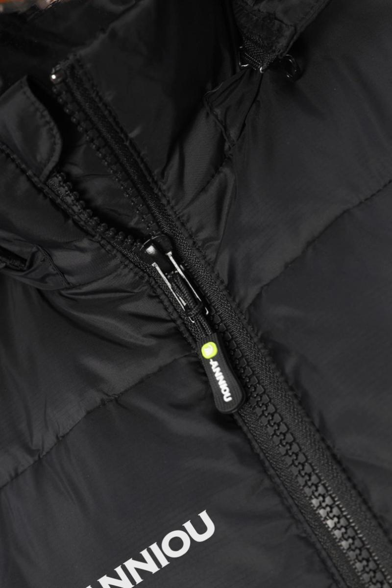 Close-up of a black puffer jacket with a white ANNIOU logo
