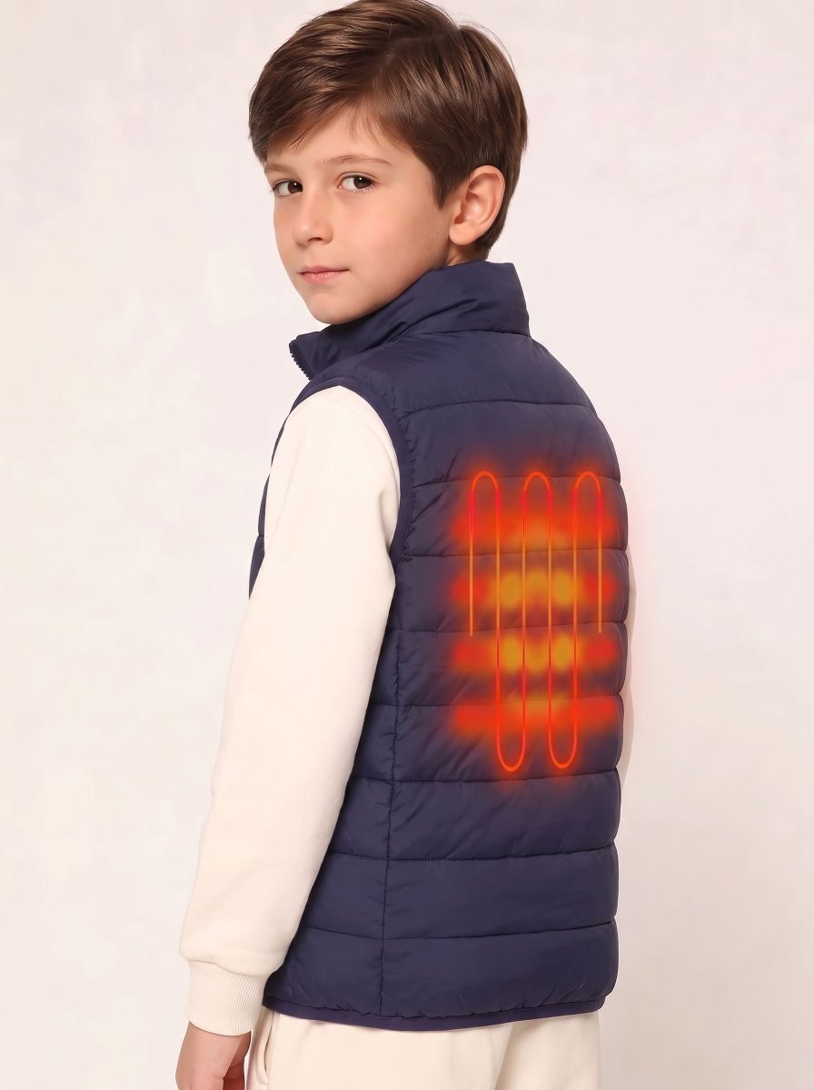 A young boy wearing a navy blue puffer vest over a cream long-sleeve shirt, shown from the back. The vest features a glowing orange graphic overlay representing a built-in heating element on the back.