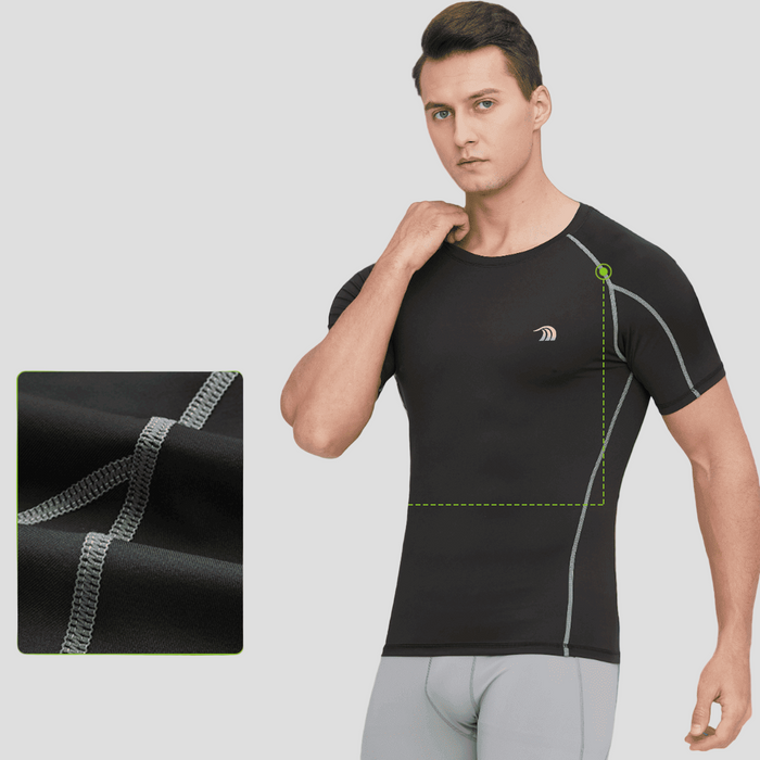 Man wearing a black compression shirt with UPF50+ protection in an outdoor setting.