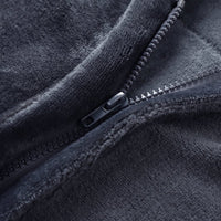Close-up of sturdy metal zipper on dark grey flannel electric heated shawl, wearable heating blanket zipper detail
