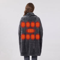 Woman wearing #darkgrey wearable heated blanket viewed from back, showing 9 heating zones marked by orange heat elements