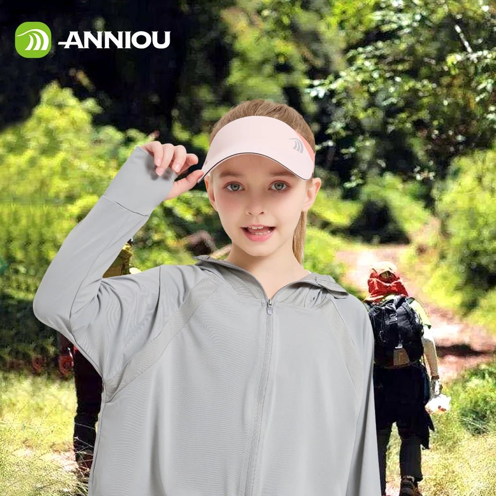 Girl wearing a pink visor outdoors with 'ANNIOU' branding.