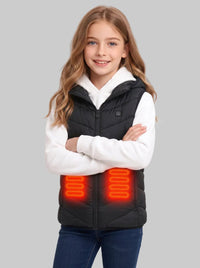 Caucasian pre‑teen girl crossing arms, wearing black hooded kids heated vest with glowing orange abdomen heating panels, matched with white hoodie and jeans,children winter electric warm gilet