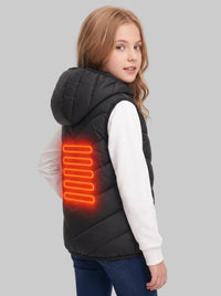 Three‑quarter back view of 10‑11 years old caucasian girl in black kids heated hooded vest, glowing orange rear heating sheet, looking back at camera
