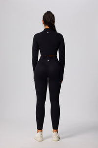 Person wearing a black athletic outfit on a white background Anniou Leggings and Sports Jacket