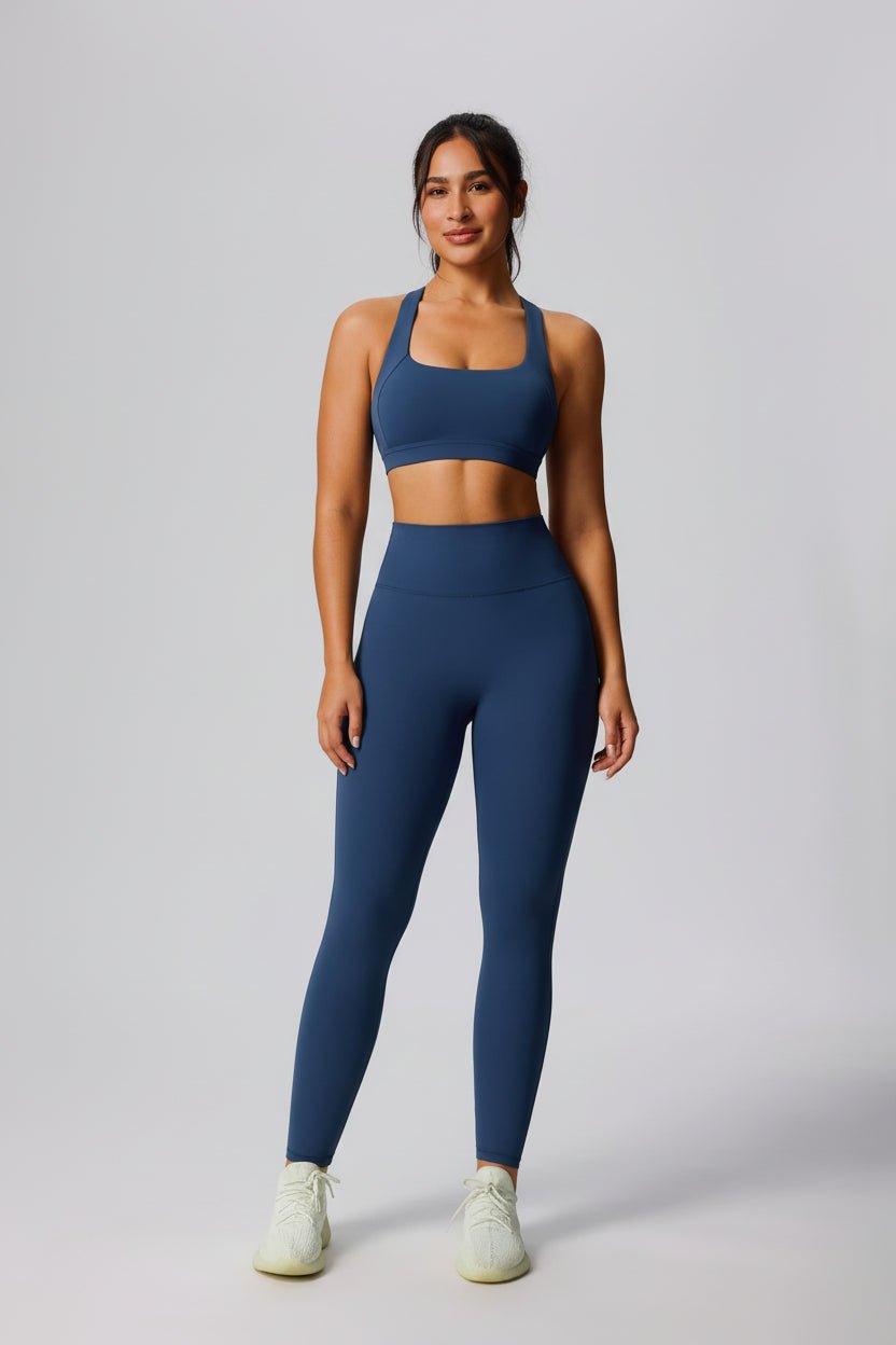 Woman wearing a blue UPF 50+ Yoga outfit with sports bra and leggings