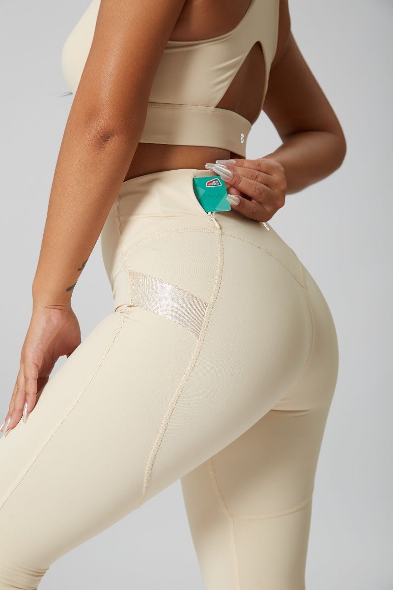 women's beige leggings and sports bra with pocket