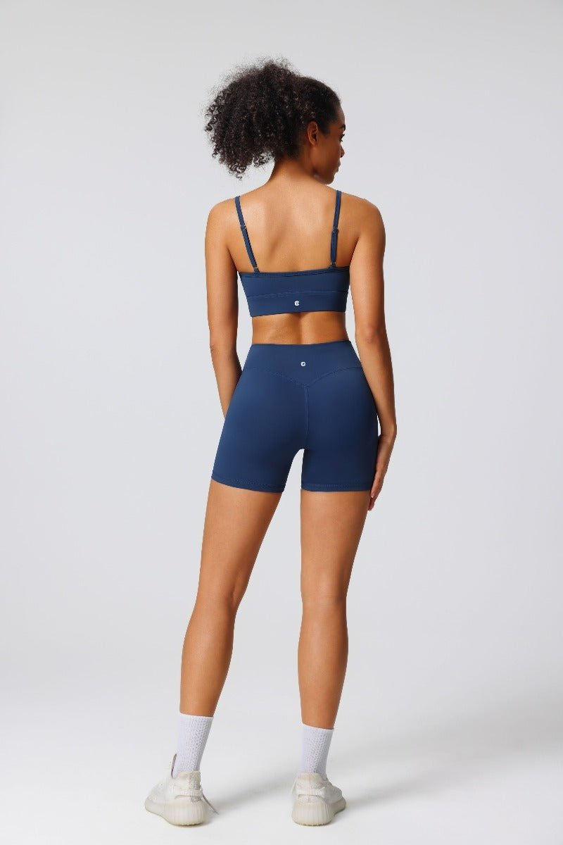 Person wearing a blue athletic outfit on a white background