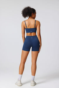 Person wearing a blue athletic outfit on a white background