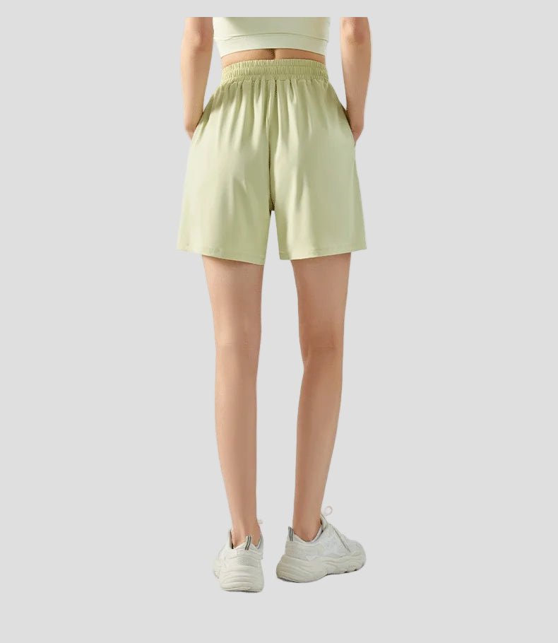 Person wearing light green shorts on a white background by anniou from behind