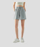 Person wearing light gray sun protection athletic shorts on a white background
