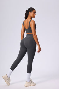 woman wearing grey UPF 50+ athletic yoga set