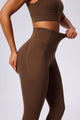 UPF 50+ brown yoga leggings and sports bra on a light gray background