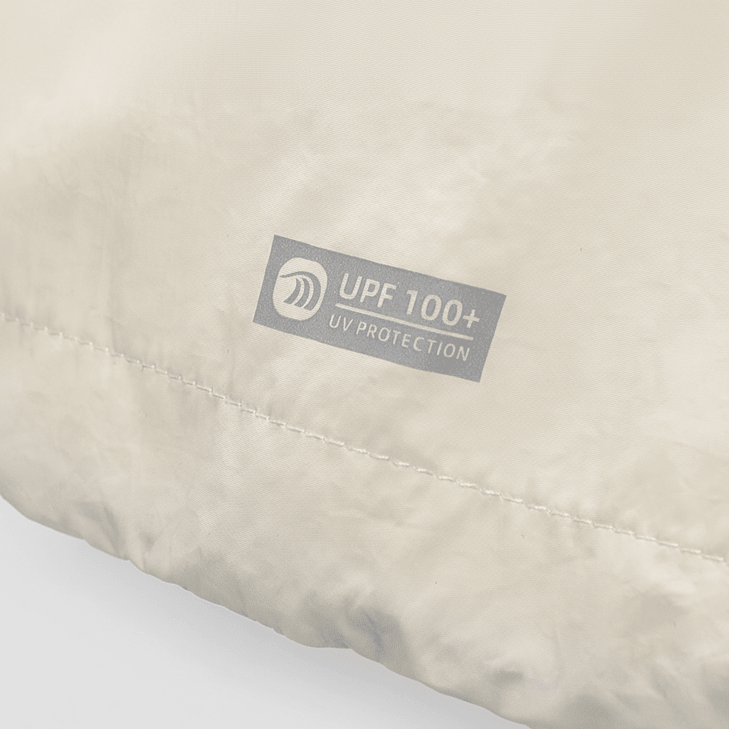 Beige fabric with a UPF 100+ UV protection label beige