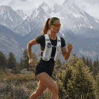 A woman, carrying a water bottle, enjoys a comfortable run outdoors.