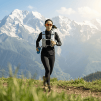 A woman wearing a sports vest is doing a cross - country run outdoors