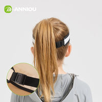Child wearing a headband with a close - up of the strap on a light gray background, featuring the brand 'ANNIOU'.