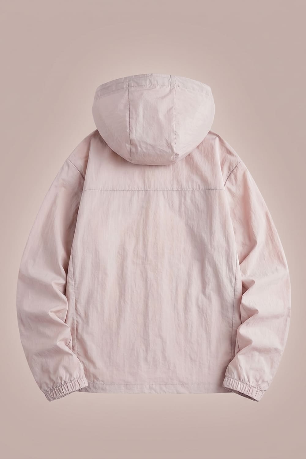 Light pink hooded jacket on a beige background