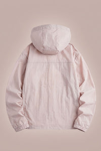 Light pink hooded jacket on a beige background