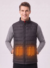 Smiling male model in black heated vest, glowing heating elements on waist, men’s electric warm gilet studio shot