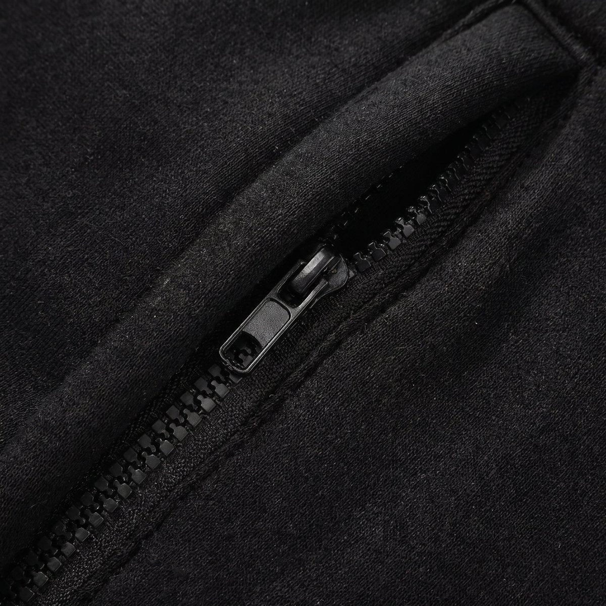 zipper pocket detail of #Black Heated Zip Up Hoodie