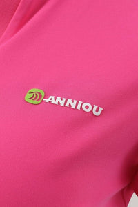 Close - up of a pink fabric with 'ANNIOU' logo in white and green.