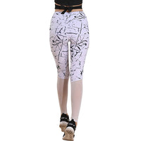 White leggings with black abstract pattern worn by a person on a white background