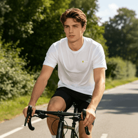 A man wearing a white quick - drying T-shirt is riding a bicycle.