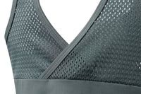Gray sports bra with mesh detailing on a white background
