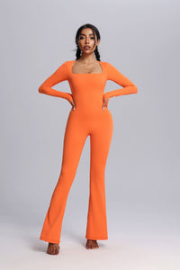 Woman wearing a Orange UPF 50+ Yoga Jumpsuit with Thumbholes