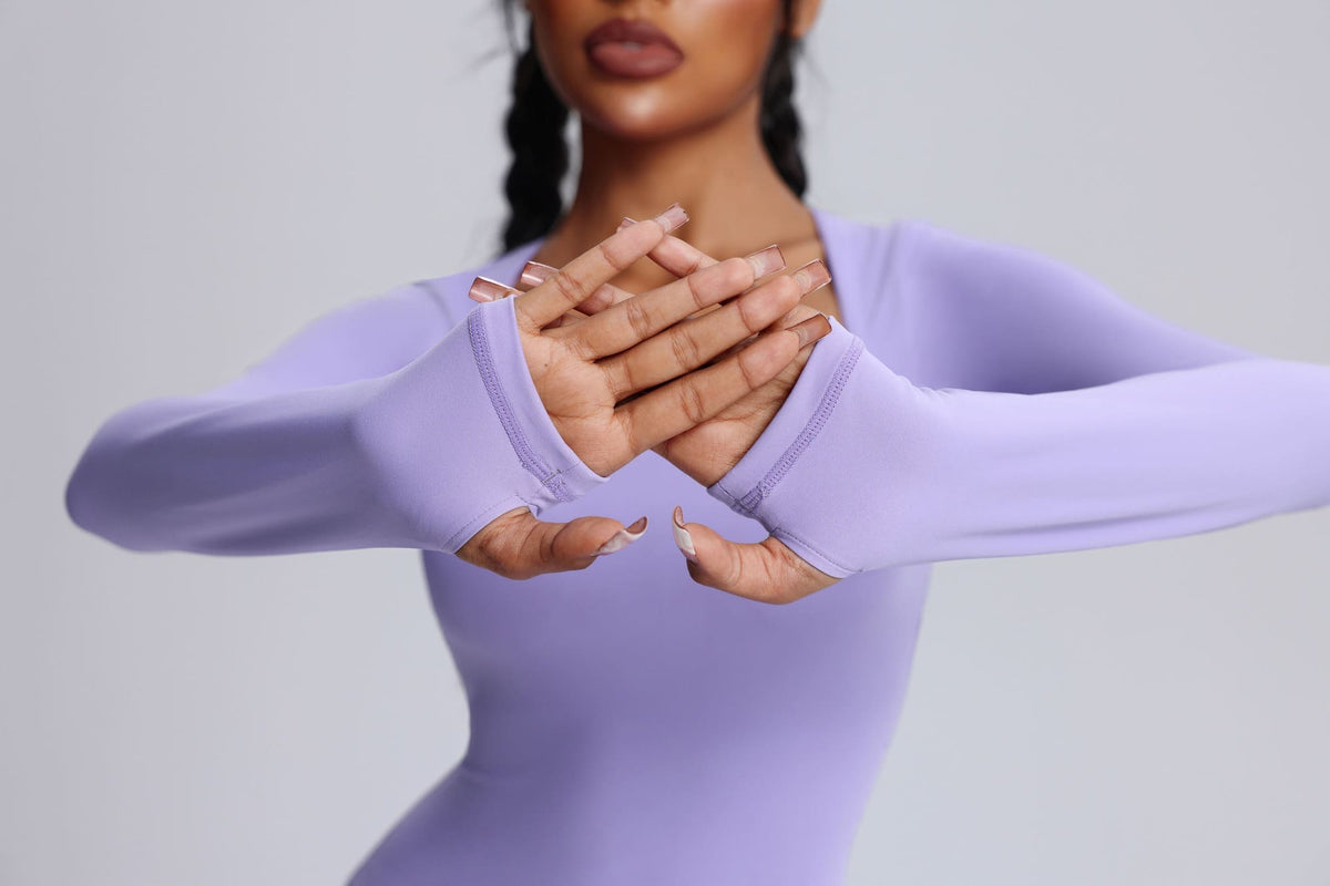 Women's UPF 50+ purple jumpsuit with thumbholes