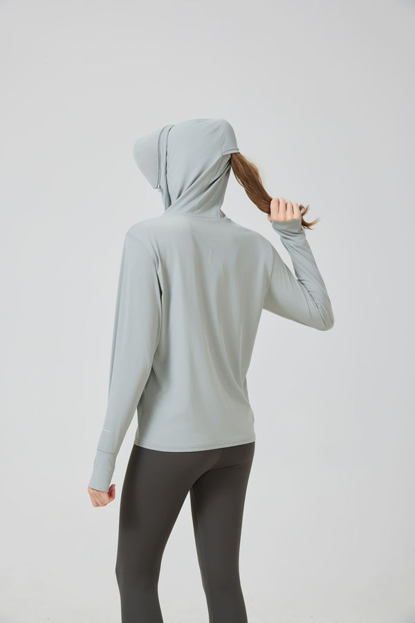 woman wearing a Sun Protection Jacket with hood that allows hair through, UPF 100 protective fabric in light gray 