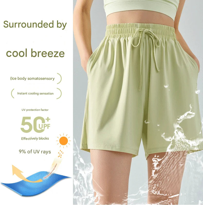 Light green shorts with UPF 50+ protection on a gray background