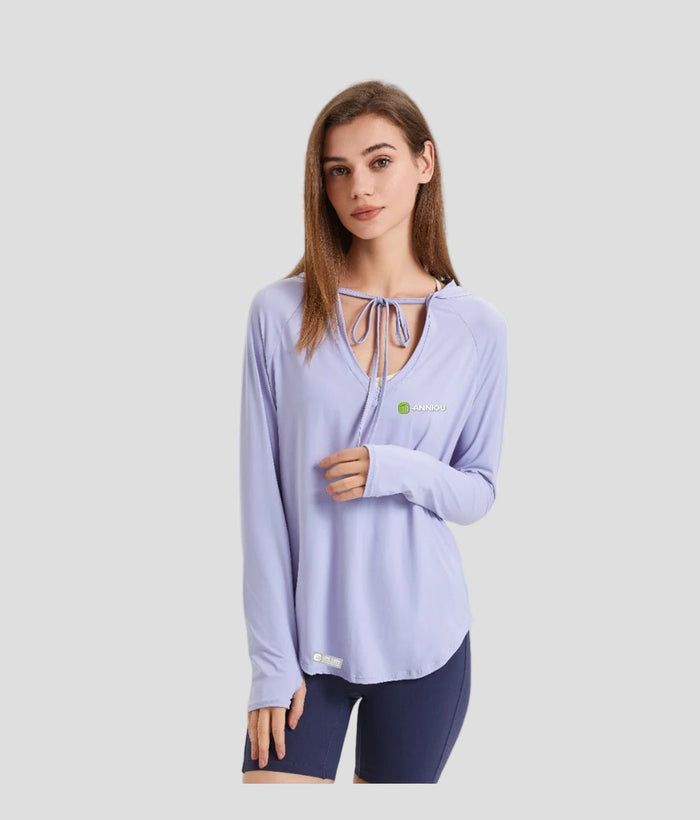 Woman wearing a light purple long - sleeve upf 100 top with a brand logo on a white background