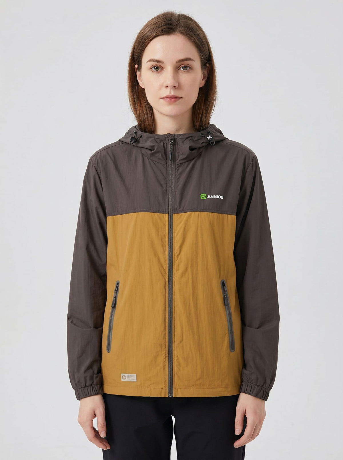womens brown UPF 50+ breathable jacket hooded zip-front jacket with a color-block design in brown and orange