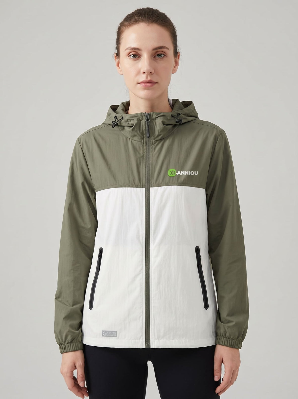 womens dark green upf 50+ breathable jacket hooded zip-front jacket with a color-block design in green and white