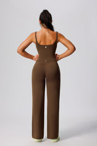 Women's UPF 50+ green yoga vest and pants from behind