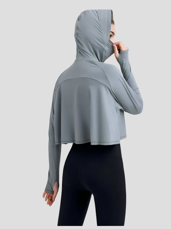 UPF 50+ Hooded Cropped Shirt and black leggings from the back in Gray
