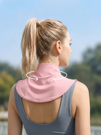 A woman shown from the back wearing a pink neck collar with white arrows indicating neck rotation, set against a blurred outdoor background.