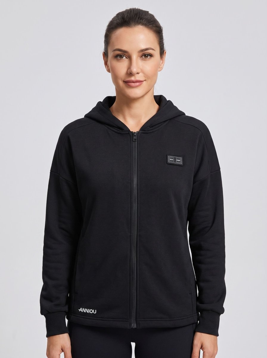A woman wearing a black zip-up heated hoodie by Anniou