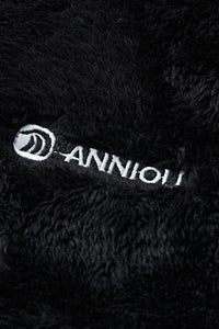 Close - up of a black textured fabric with 'ANNIOU' logo.