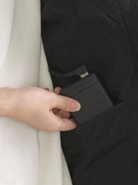 Built-in hidden pocket for convenient storage of a power bank